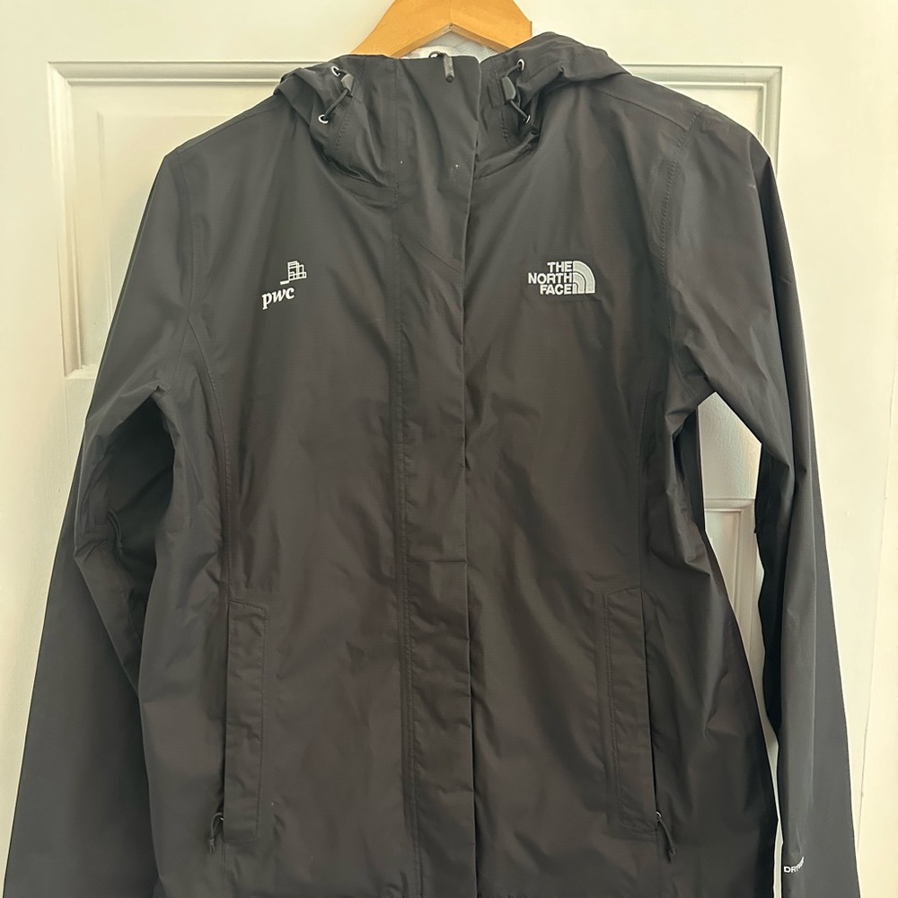 Black women’s north face rain jacket with PwC logo